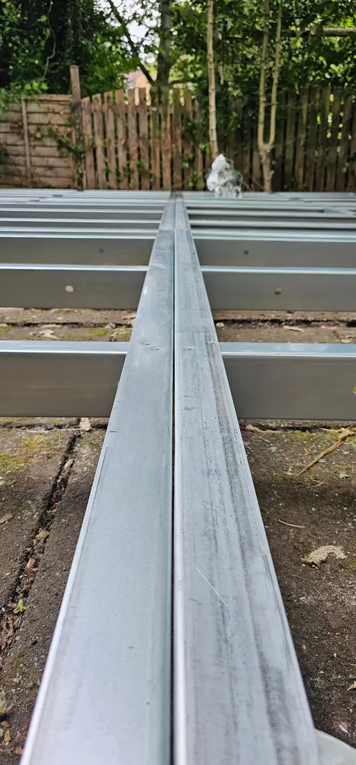 Close view along aligned light gauge steel floor-frame members