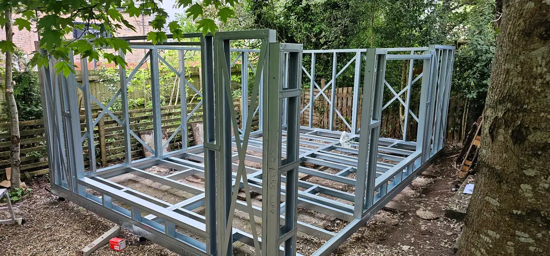 Erected steel wall panels showing structural openings and diagonal bracing