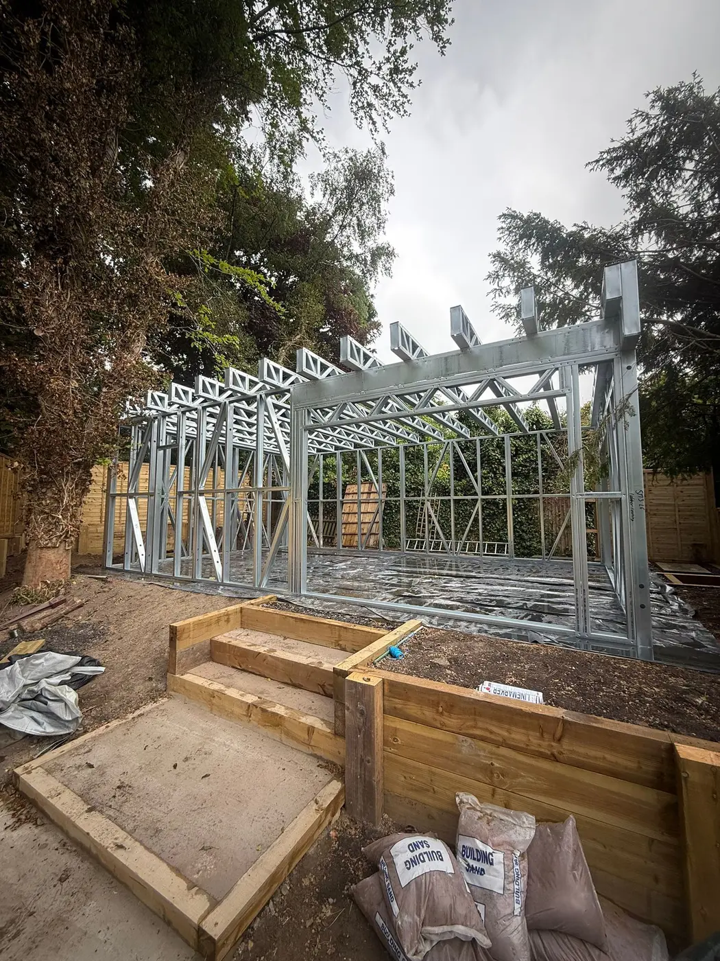 Large multi-bay Forti Nova light gauge steel garden building during frame erection